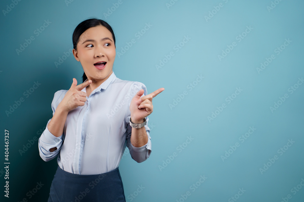 Asian woman happy surprised isolated on blue background. Asian woman happy surprised isolated on blue background.