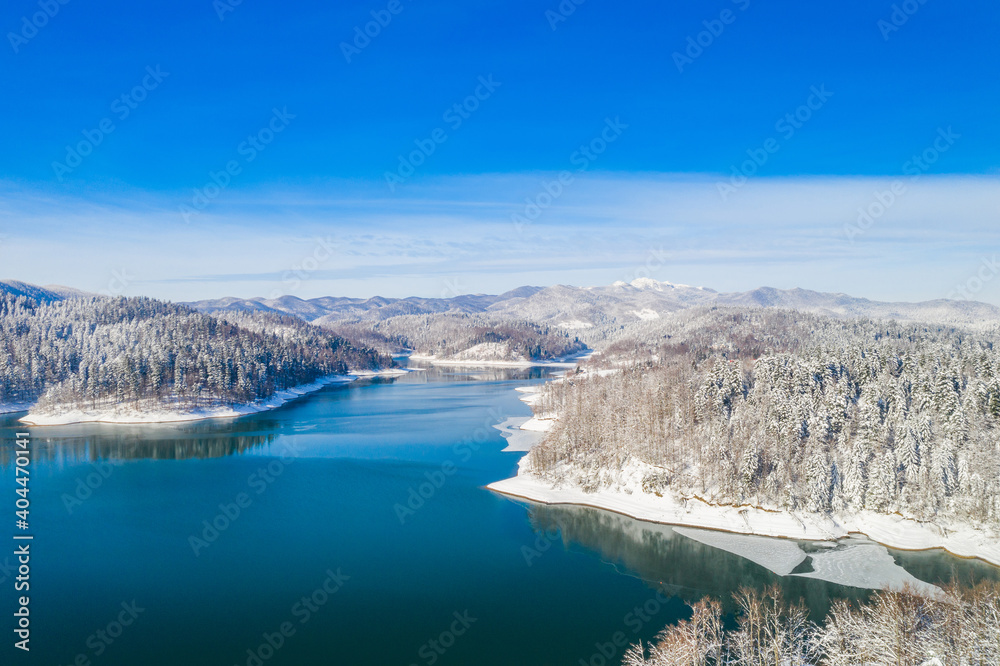 Beautiful showy winter landscape in Croatia. Panorama of Lokvarsko lake and in Gorski kotar from drone.