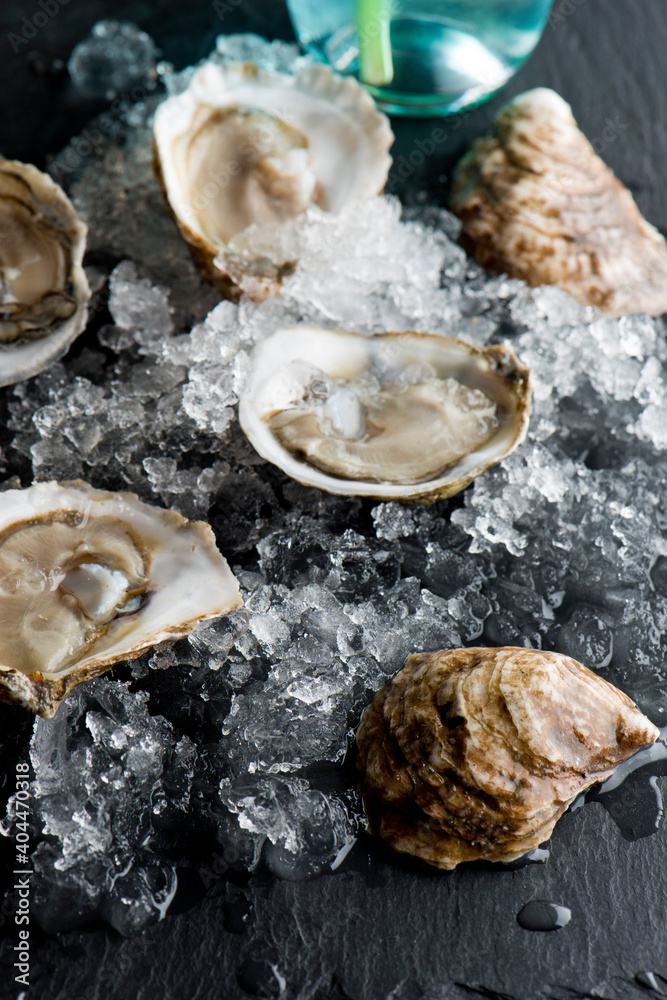 Oysters. Oysters on the half shell. Fresh oysters served with garlic, shallots, cocktail sauce, mignonette sauce and fresh lemons and limes. Classic American steakhouse or French bistro appetizer. Oysters. Oysters on the half shell. Fresh oysters served with garlic, shallots, cocktail sauce, mignonette sauce and fresh lemons and limes. Classic American steakhouse or French bistro appetizer.