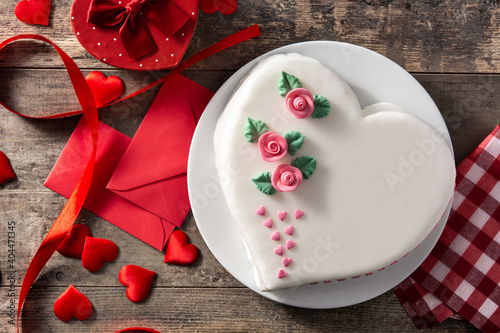 Heart cake for St. Valentine's Day, Mother's Day, or Birthday, decorated with roses and pink sugar hearts 
