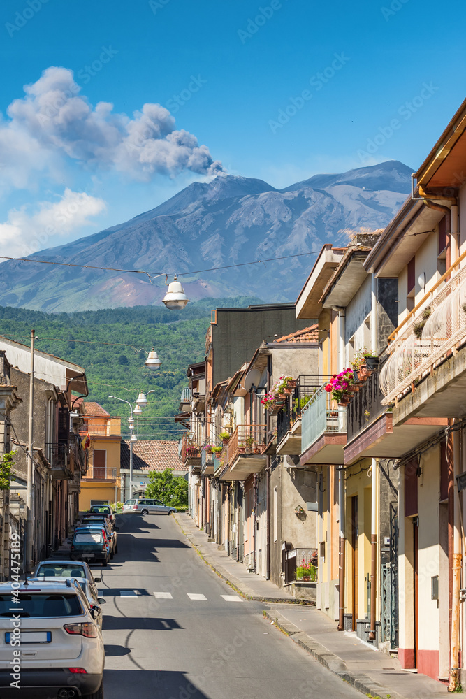 Typical sicilian street with a view at Etna volcano eruption in Piedimonte Etneo town, Sicily Typical sicilian street with a view at Etna volcano eruption in Piedimonte Etneo town, Sicily