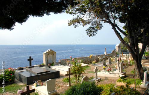 The suggestive cemetery of Porto Venere overlooking the Mediterranean sea and the fortress where the Romanesque church of San Pietro stands spellbound.