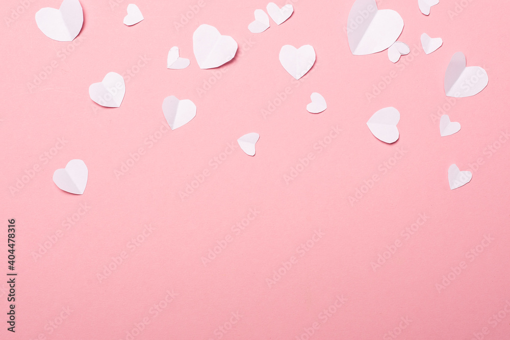 Valentines made of paper in the shape of a heart on a pink background. Composition of Valentine's Day. Banner. Flat lay, top view