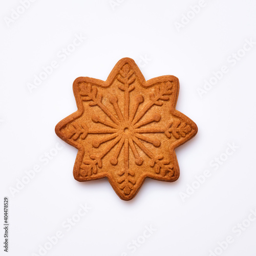 New Year gingerbread or snowflake shaped cookies isolated on white background. Square image. Top view.