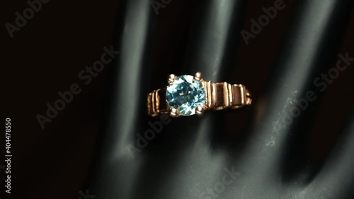 silver ring with natural gemstones on the black hand