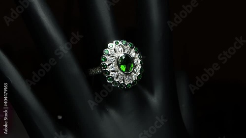 silver ring with natural gemstones on the black hand