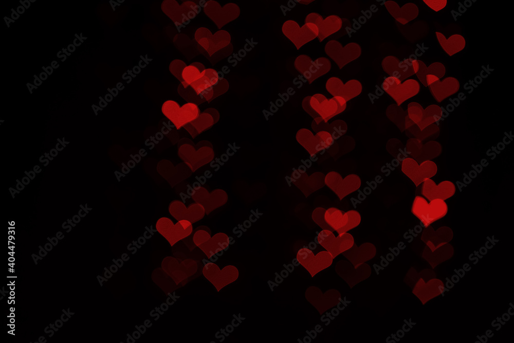 Red hearts bokeh on black background Red hearts bokeh on black background