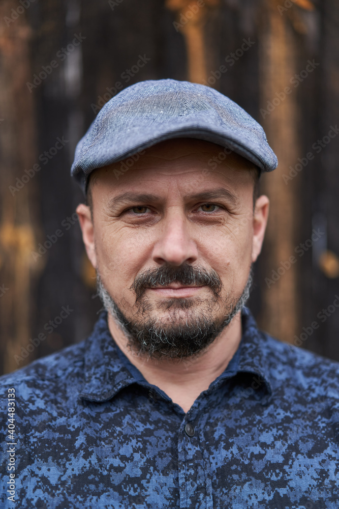 Middle aged man against barn wood background Middle aged man against barn wood background