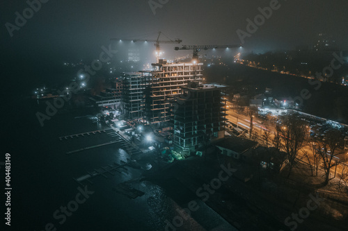 Fototapeta Naklejka Na Ścianę i Meble -  night city in fog from a bird's-eye view