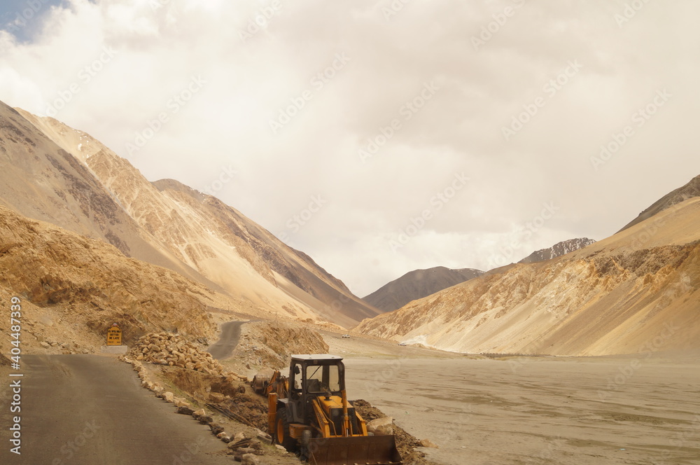 Construction work along the road in the sandy mountains of Himalayas