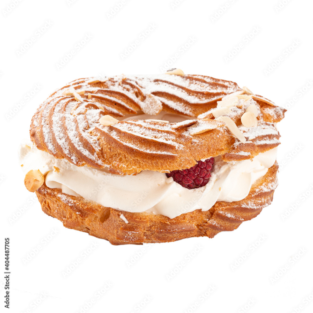 Fototapeta premium Isolated Paris-Brest cake with cream and raspberry on the white background