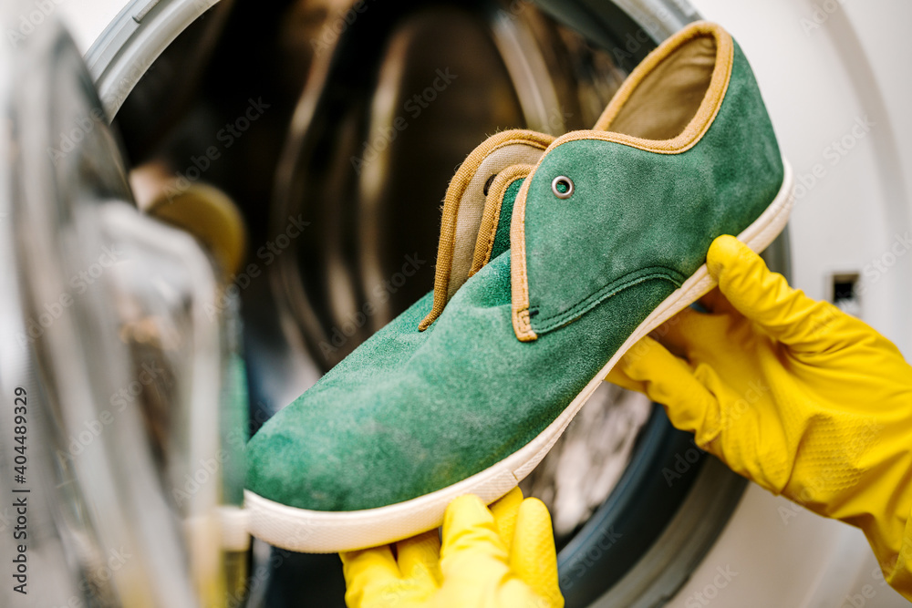 Washing and cleaning dirty shoes in the washing machine. Shoe care. Washing and cleaning dirty shoes in the washing machine. Shoe care.
