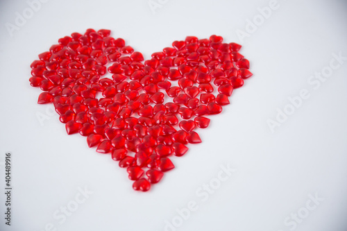 Red heart compositions on a white background.
