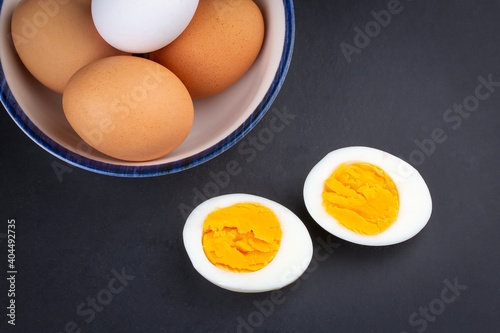 Boiled egg served on a black background