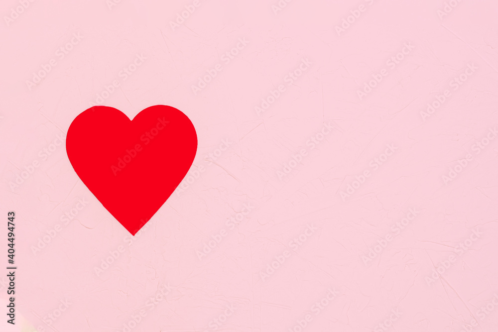 Red big heart on pink background with plaster texture. Valentine's day concept, wedding, love