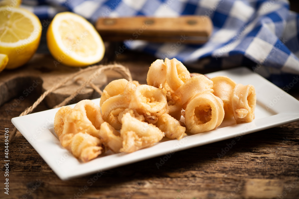 Traditional Italian fried calamari and lemon slice