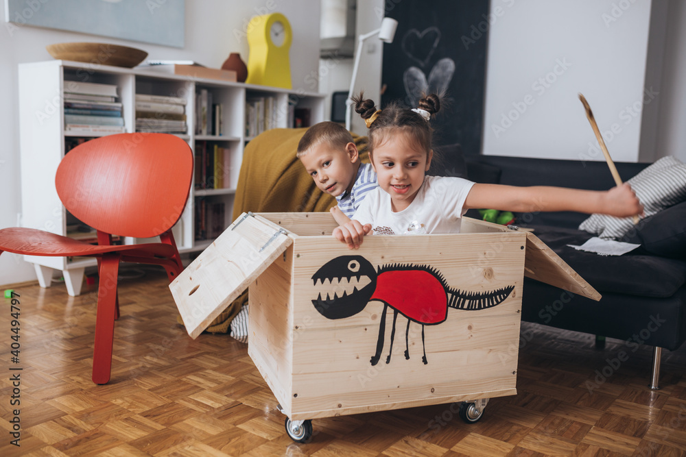 Obraz na plátně kids playing in their living room at home