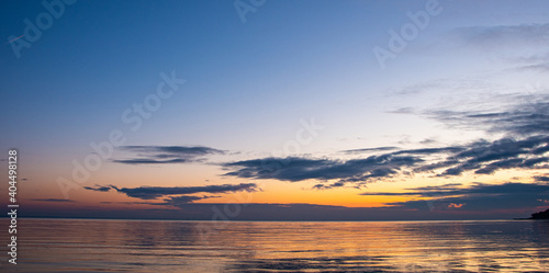 December sunrise with a beach and sea bay in the background