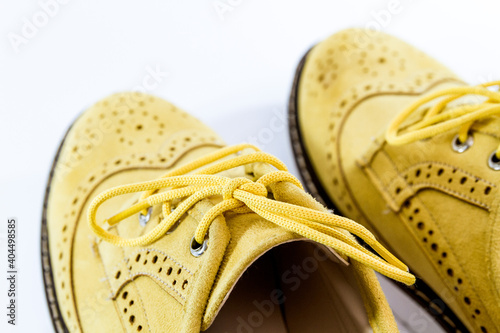 Yellow-orange women shoes, isolated on white