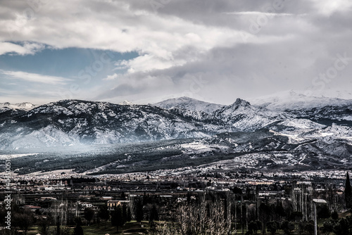 landscape with snowy mountains and Granada city line