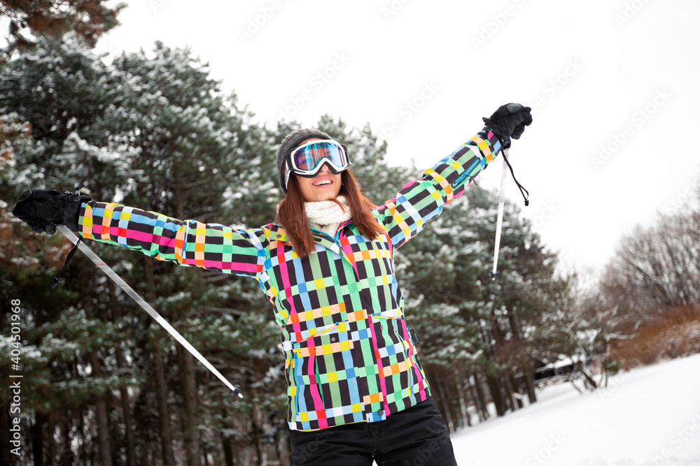 Pretty girl having fun on the skis