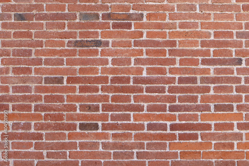 Real modern orange brick wall background texture. Masonry of the modernisme style.