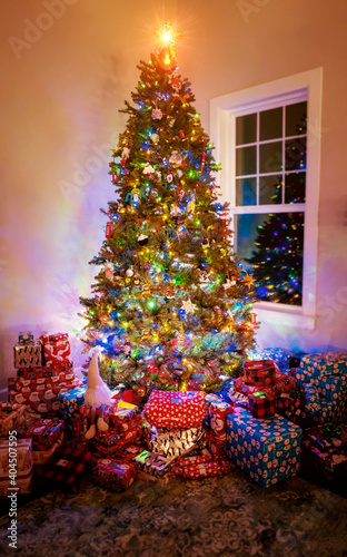 Beautiful Christmas tree surrounded by presents