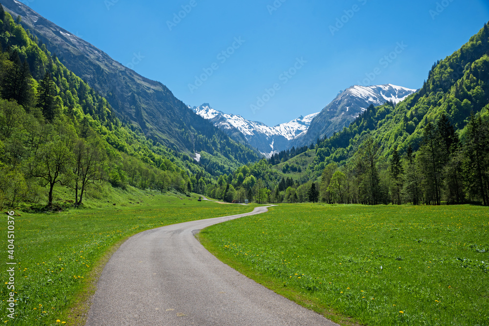 stunning spring landscape, Trettach valley and walkway, view to snowy allgau alps stunning spring landscape, Trettach valley and walkway, view to snowy allgau alps
