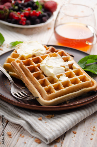 Belgian waffles served with butter and honey