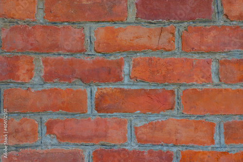 Old brick wall with devastating bricks for background.