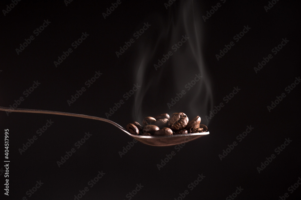 spoon of coffee beans spoon of coffee beans
