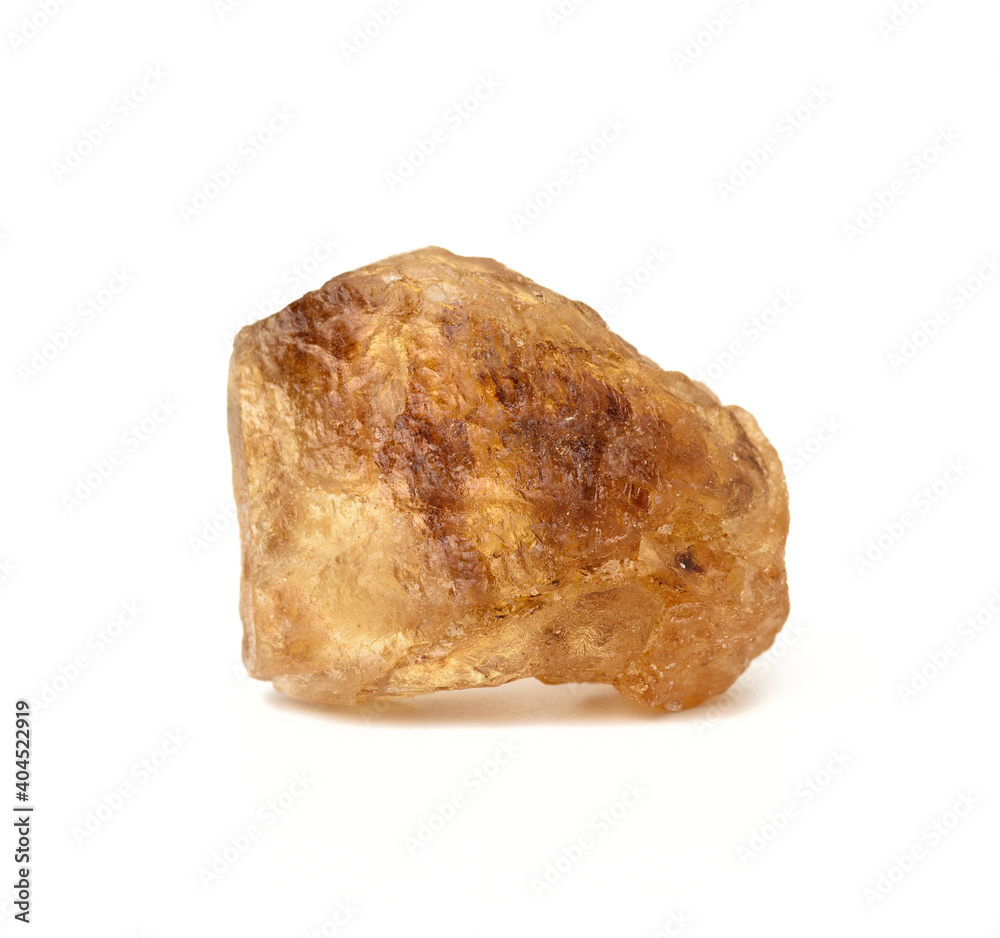 lump of brown cane sugar isolated on white background lump of brown cane sugar isolated on white background