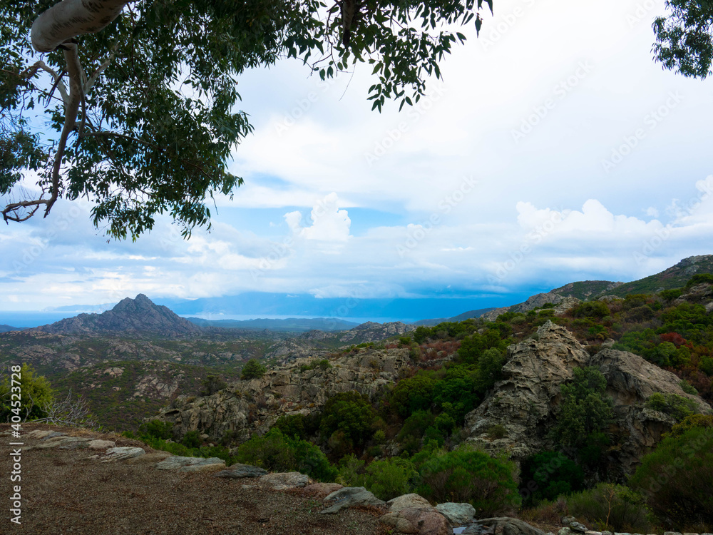 Φωτογραφία Beautiful landscape of mountains in the desert des Agriates, blue sky and cumulus clouds