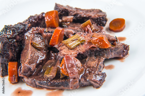 pork cheek cooked with red wine at low temperature typical dish of Lazio and Toscana region in Italy