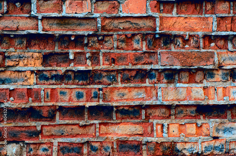 Old weathered red brick wall. Grunge background.