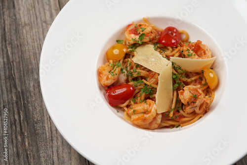 Spaghetti pasta with tomato, shrimps and cheese
