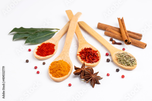 Various spices on white bac...