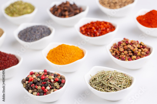 Assorted various spices on white background