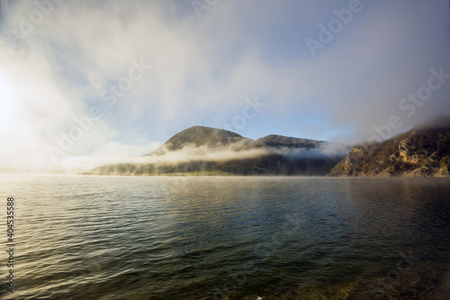 A foggy day at Lake Turano. The colors of autumn in Castel di Tora in Rieti