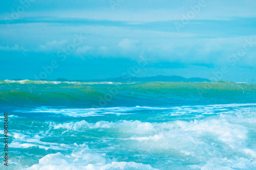 Beautiful ocean blue waves in morning. © noppadon