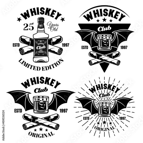 Whiskey set of four vector emblems, badges, labels or logos in vintage monochrome style isolated on white background