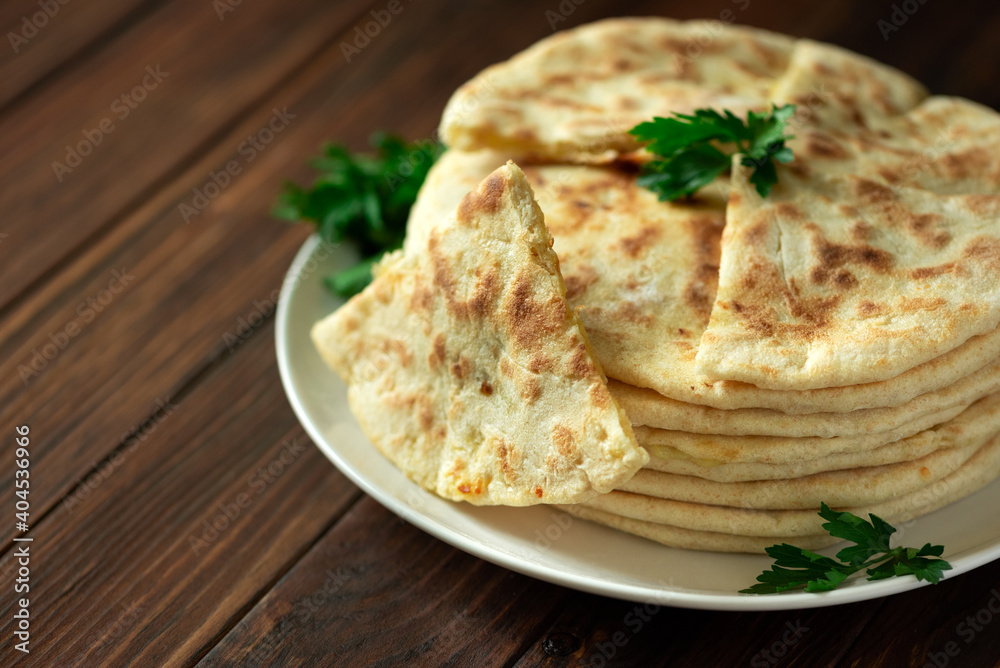 Khachapuri. Georgian traditional dish made from sulguni cheese and bread. Selective focus