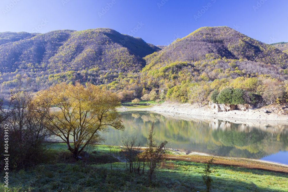 Lake Turano in Rieti.The colors of autumn. Reflections in water