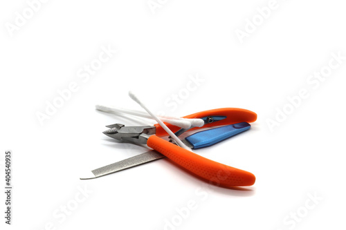 nail clippers ear sticks and nail file on white background