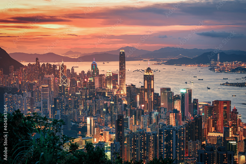 Hong Kong city on dramatic sky at sunset view from mountain. - obrazy, fototapety, plakaty 