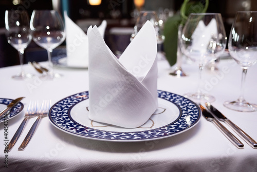 Table Setting With Napkin On Plate, Fork, Knife And Glasses