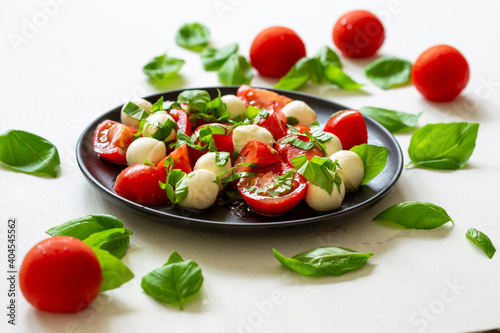 Italian food Bocconcini, Tomato and Basil Salald photo