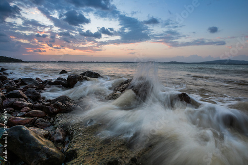 A twilight time after sunset on beach with stone foreground © pattierstock