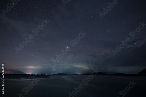 A star at nigh sky with cloudy at night time © pattierstock