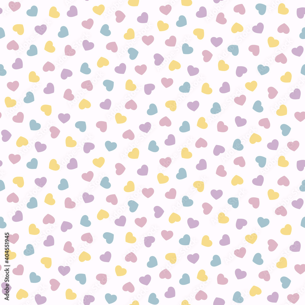 Seamless pattern of small scattered pastel hearts.
